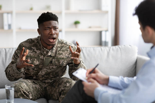 istock Emotional military black man gesturing while talking to psychotherapist 1467632161