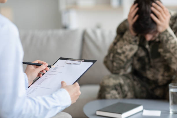 istock Distressed veteran attending therapy session with psychotherapist 1467632187