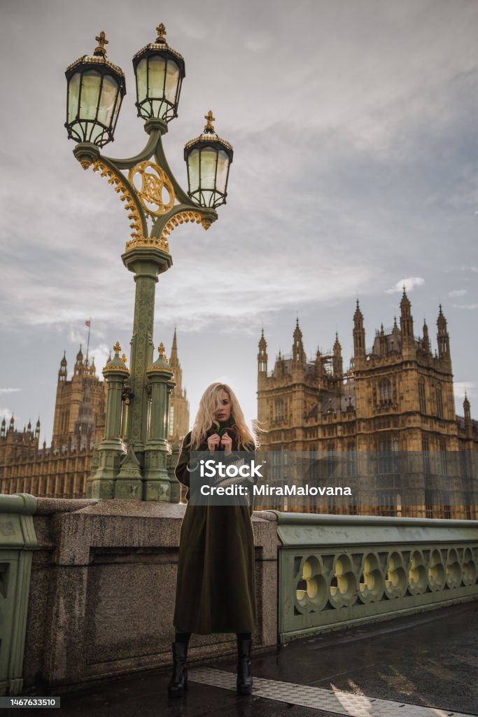 Stylish girl on Westminster Bridge in London on sunset, United Kingdom 35-39 Years Stock Photo Stylish girl on Westminster Bridge in London on sunset, United Kingdom 35-39 Years Stock Photo