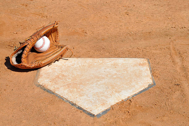 istock Baseball in Glove at Home Plate 146763520