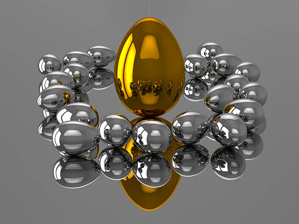 Unique golden egg with silver eggs stock photo