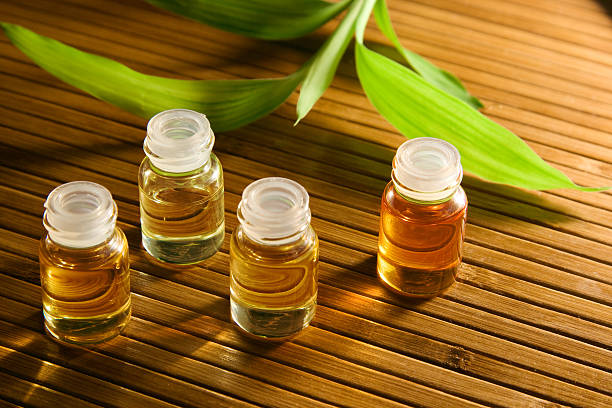 istock bottles of aroma oils and bamboo on mat 146763977