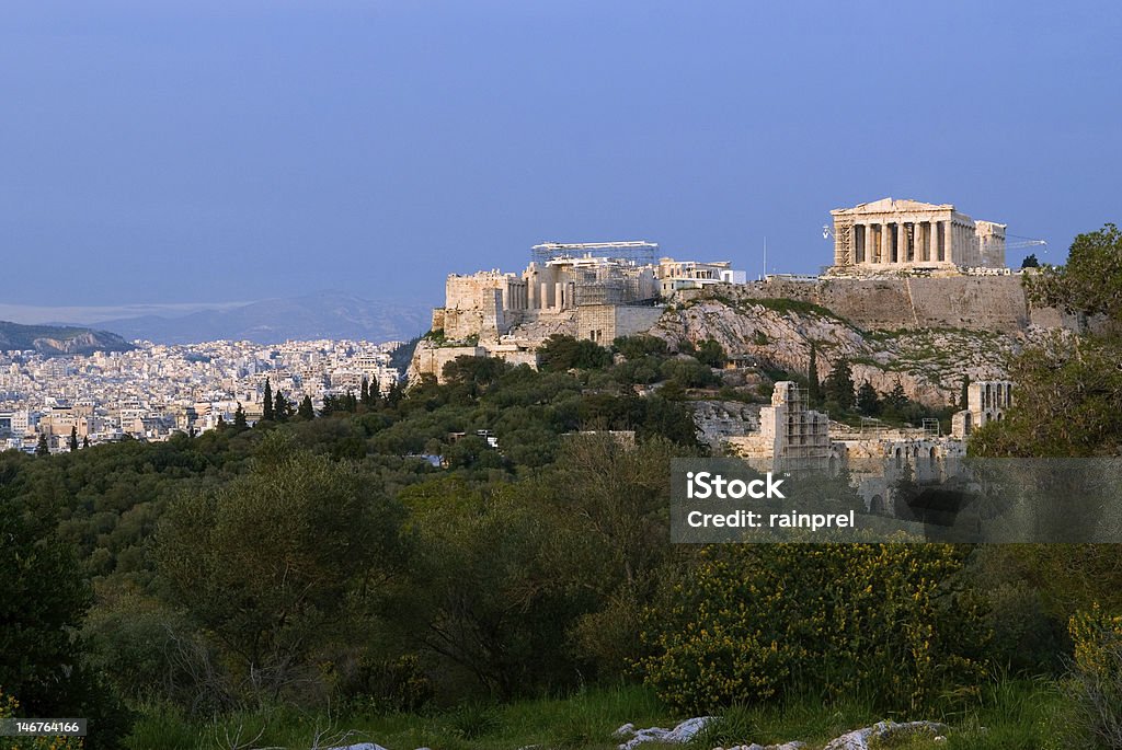 Acropolis and City of Athens The Parthenon sits in the rock of the Acropolis during late afternoon light in Athens, Greece. Acropolis - Athens Stock Photo