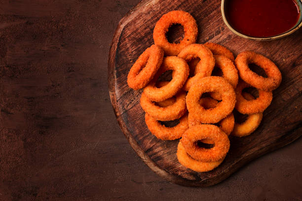 istock crispy chicken rings, fried, on a wooden board, close-up, 1467642173