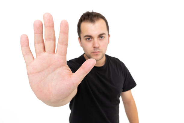 Young man with stop sign white background. Halt!