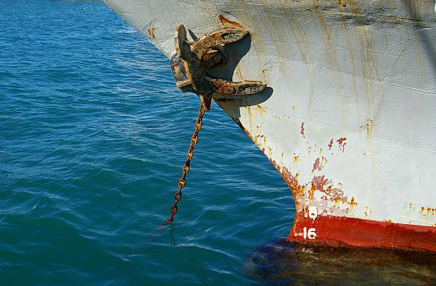 Rusty anchor and chain stock photo