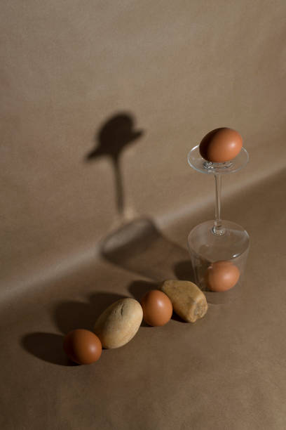 Set of eggs and stones. Minimalist arranged food set up. Minimalistic food still life. Easter concept