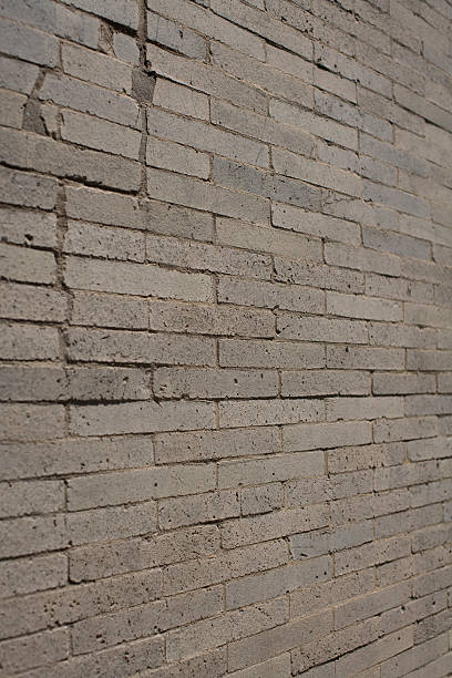 グレイのレンガの壁の古い石づくり ストックフォト