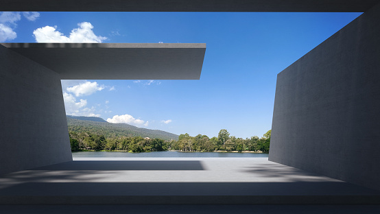 Space for products showcases in the concrete hallway with a pond and mountain background.3D rendering.