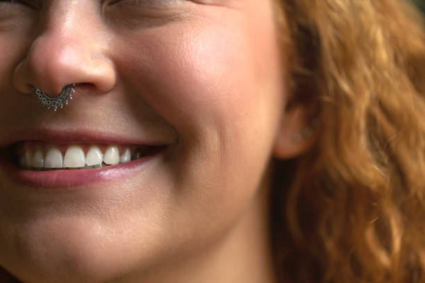 A closeup of a childs joyful smile, highlighting their delicate features and innocence