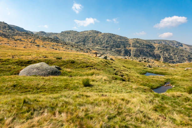 Woman hiking through extreme terrain