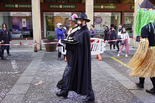 Sesto Calende, Italy - February 19, 2023: Parade of people and allegorical floats through the streets of Sesto Calende to celebrate the Carnival