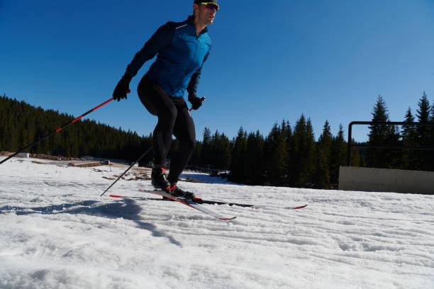 istock Nordic skiing or Cross-country skiing classic technique practiced by man in a beautiful panoramic trail at morning.Selective focus. 1467663321