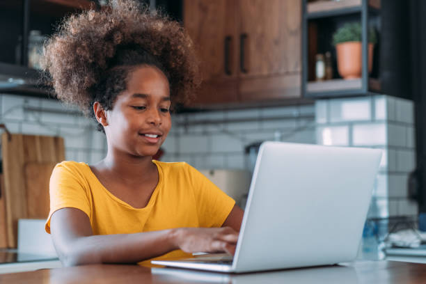 istock Girl using laptop at home. 1467663679