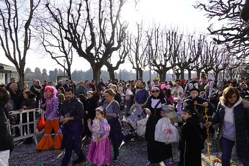 Sesto Calende, Italy - February 19, 2023: Parade of people and allegorical floats through the streets of Sesto Calende to celebrate the Carnival