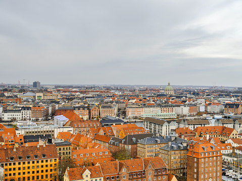 Copenhagen's colorful buildings during a cloudy day, Denmark