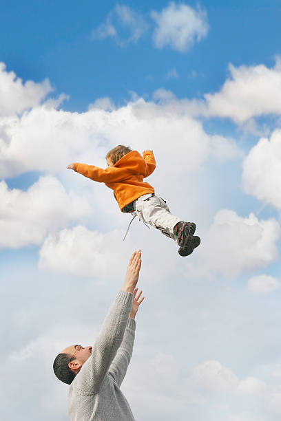 istock flying child over sky background 146767081