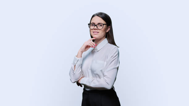 istock Smiling young woman looking at camera on white background 1467674495