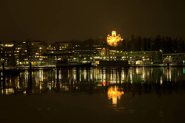 Cityscape at Night in Lappeenranta A nightly cityscape reflecting from the water in the harbor of Lappeenranta. lappeenranta stock pictures, royalty-free photos & images