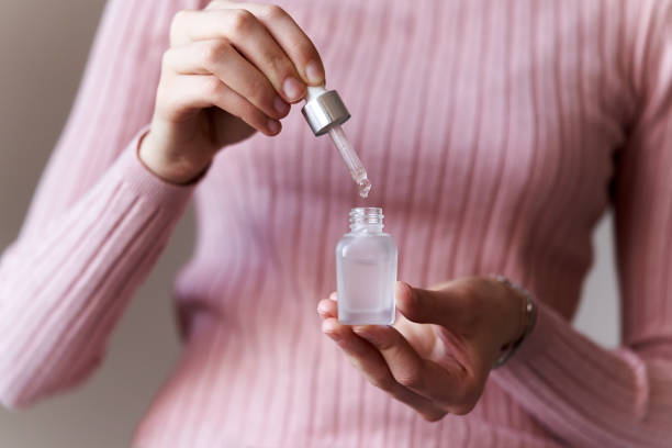 istock Drop falling into a bottle of aromatherapy essential oil 1467677153