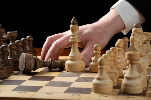 White chess king is the winner.