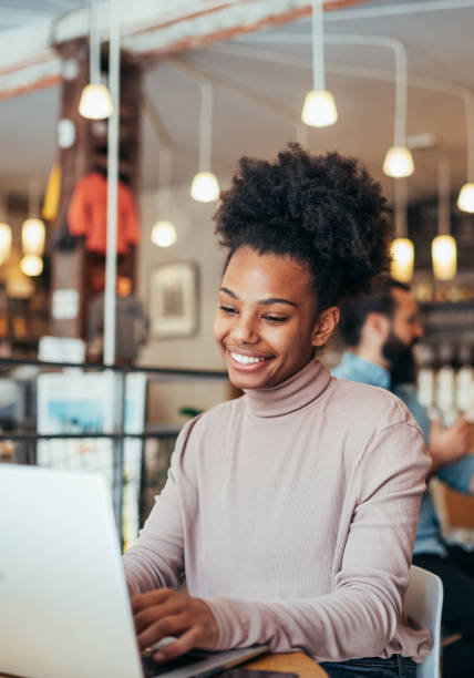 istock African American entrepreneur working remotely on laptop from cafe 1467678235