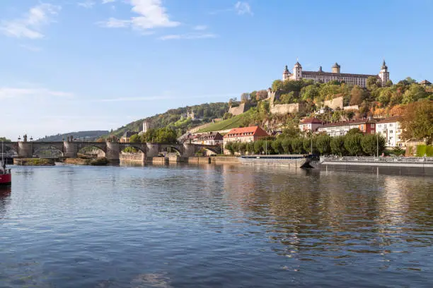 Main river with a view of the medieval bridge, Alte mainbrücke  in the historic city of Wurzburg, Bavaria; Germany.