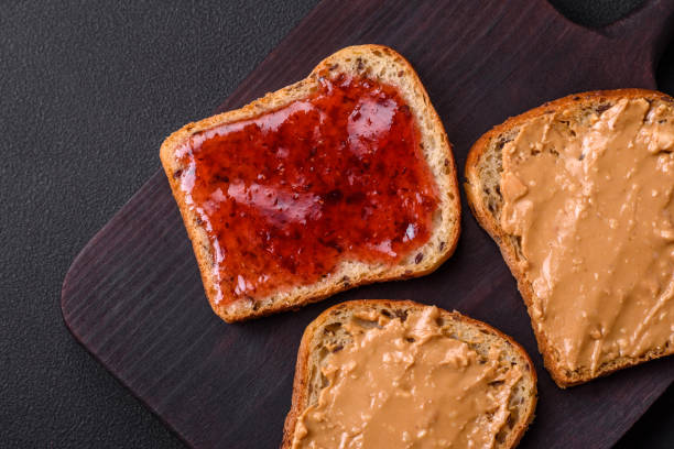 istock Nutritious sandwiches consisting of bread, raspberry jam and peanut butter 1467685108