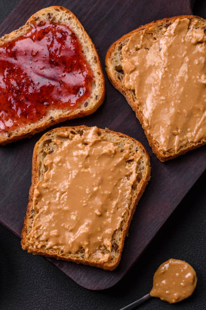 istock Nutritious sandwiches consisting of bread, raspberry jam and peanut butter 1467685143