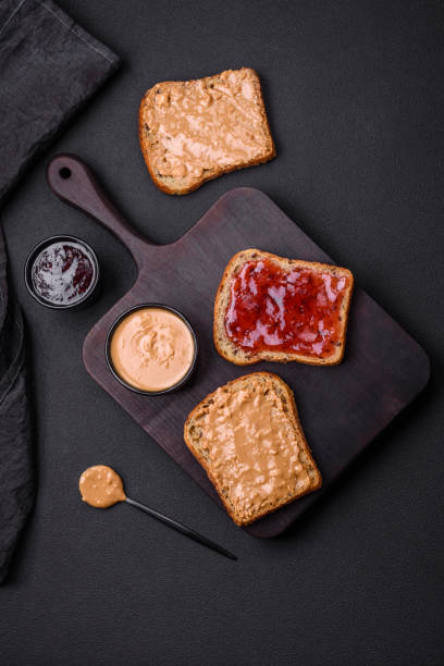 istock Nutritious sandwiches consisting of bread, raspberry jam and peanut butter 1467685310