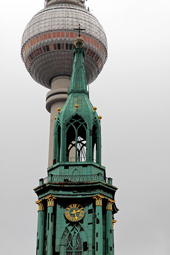 The towerbell of Marienkirche and the Fernsehturm - Berlin