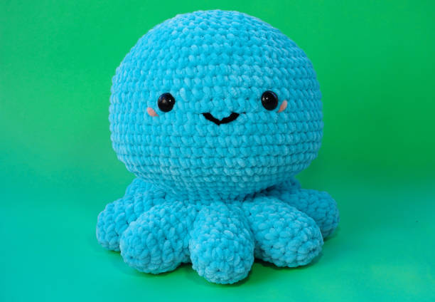 istock hand knitted cute octopus photo 1467685675