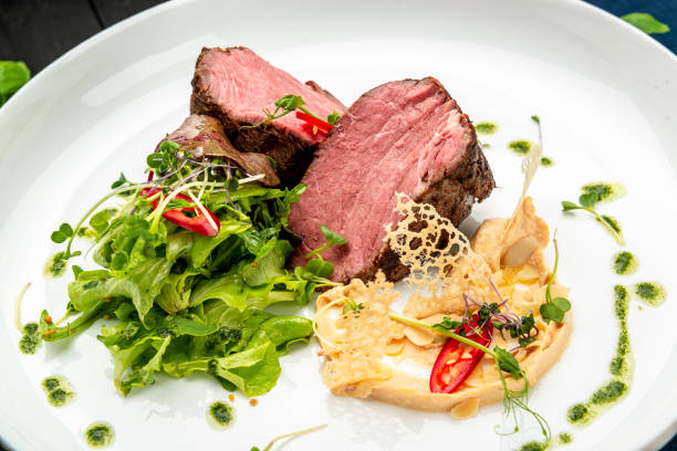 istock Veal medallion with salad and hummus hummus 1467687071