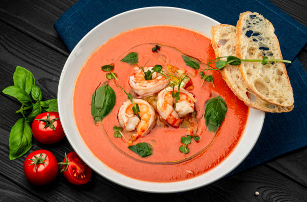 istock Delicious cold tomato soup or gazpacho with shrimps. 1467687212