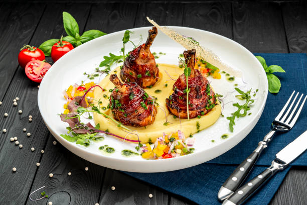 istock Chicken legs wrapped in bacon with barbecue sauce on mashed potatoes 1467687226