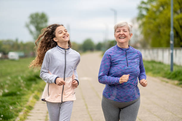 istock Grandmother and granddaughter jogging. 1467687697