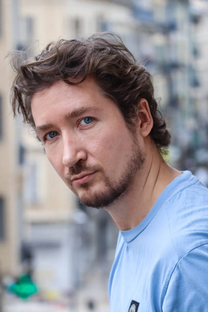 istock Handsome young man with blue eyes and curly wavy hair 1467688667