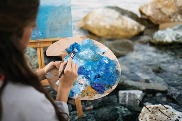 istock An artist mixing colours on the palette 1467688793