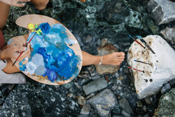 istock An artist mixing colours on the palette 1467688909