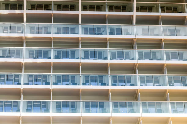 Rows of balconies on a cruise ship, side view, full frame horizontal composition