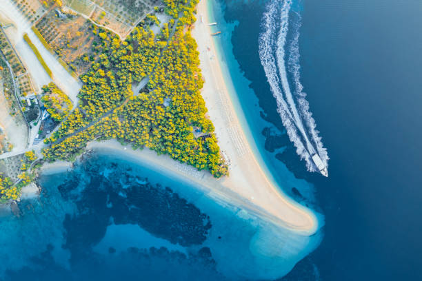 Panoramic aerial view at the Zlatni Rat. Beach and sea from air. Famous place in Croatia. Summer seascape from drone. Travel - image Panoramic aerial view at the Zlatni Rat. Beach and sea from air. Famous place in Croatia. Summer seascape from drone. Travel - image brac island stock pictures, royalty-free photos & images