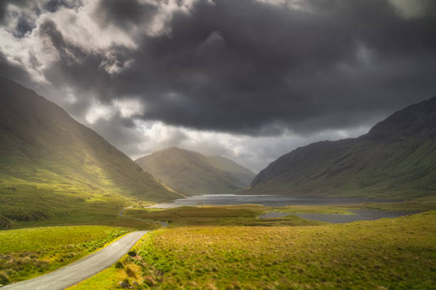 istock Road leading trough Doolough Valley with lakes andmountain range, Ireland 1467691230