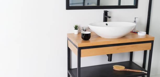 istock Minimalist bathroom with sink wooden table 1467691606