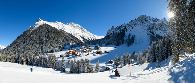 Winter landscape with snowcapped mountains and a ski slope in the ski-resort Gargellen