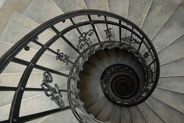винтовая лестница - directly below low angle view stone staircase стоковые фото и изображения