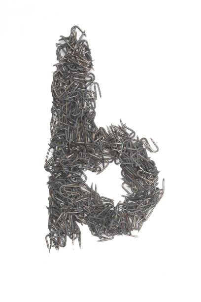 istock artistic lowercase Letter b made from steel staples isolated on a white background write, font, type style 1467696042