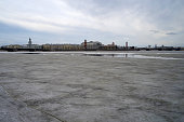 Winter view of the frozen Neva and the center of St. Petersburg, partially out of focus