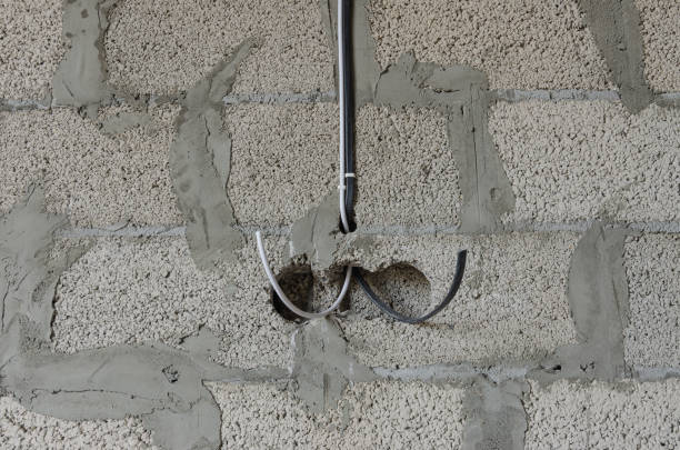 istock Electrical wiring power and internet cable during the construction of a private residential building 1467698258