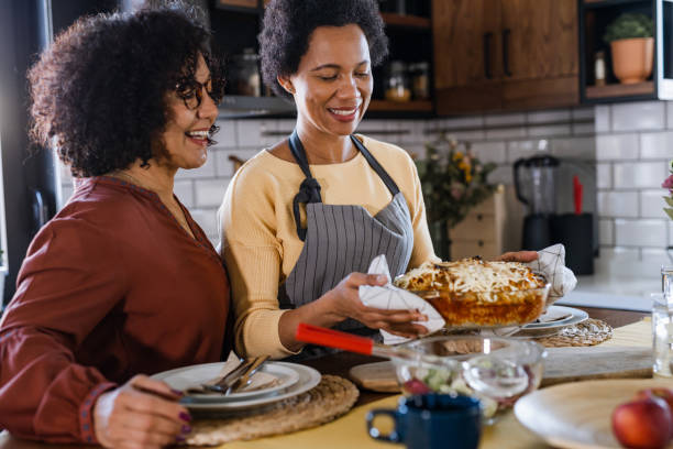 istock Lesbian couple eating at home 1467701545
