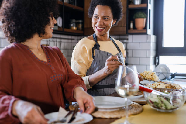 istock Lesbian enjoying a dinner at home 1467701600